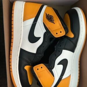 Nike Air Jordan Retro High Tops in Orange, Black, and White